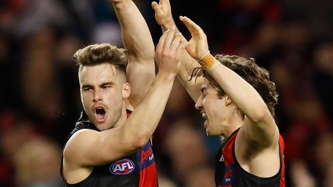 Will Snelling (left) and Andrew McGrath of the Bombers celebrate during the Round 20 match against Port Adelaide at Marvel Stadium. Picture: Michael Willson/AFL Photos via Getty Images