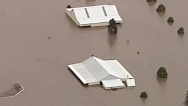 Aerial image of houses vanishing in flood waters in Camden. picture: Channel 9