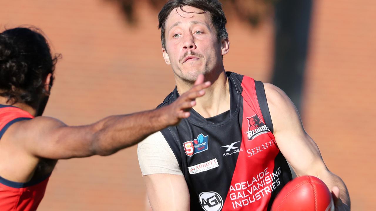 SANFL - Saturday, August 1st, 2020 - West Adelaide v Norwood at Westies home ground. West Adelaide Kaine Stevens under pressure from Anthony Wilson Picture: Sarah Reed