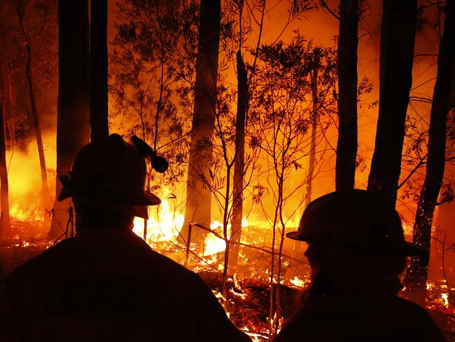 MALLACOOTA, AUSTRALIA - JANUARY 02: DELWP ( The Department of Environment, Land, Water and Planning ) and CFA ( Country Fire Authority ) Crews monitor fires and begin back burns between the towns of Orbost and Lakes Entrance in east Gipplsland  on January 02, 2020 in Australia. The HMAS Choules docked outside of Mallacoota this morning to evacuate thousands of people stranded in the remote coastal town following fires across East Gippsland which have killed one person and destroyed dozens of properties. (Photo by Darrian Traynor/Getty Images)