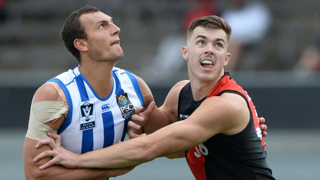 North Melbourne’s Braydon Preuss rucks against Essendon Sam Draper in the VFL. Picture: AAP/ Chris Eastman.