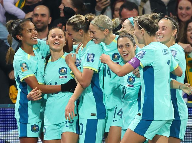 MELBOURNE, AUSTRALIA - JULY 31: Hayley Raso (2nd L) of Australia celebrates with teammate after scoring her team's second goal during the FIFA Women's World Cup Australia & New Zealand 2023 Group B match between Canada and Australia at Melbourne Rectangular Stadium on July 31, 2023 in Melbourne, Australia. (Photo by Robert Cianflone/Getty Images)