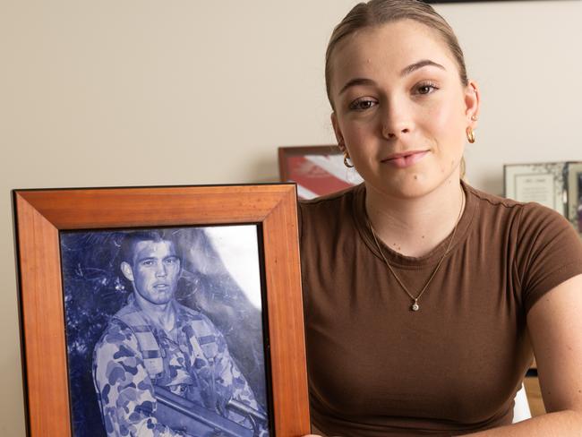 Mia Douglas with a photo of her father Kevin Douglas. Photo: Joseph Byford Photography