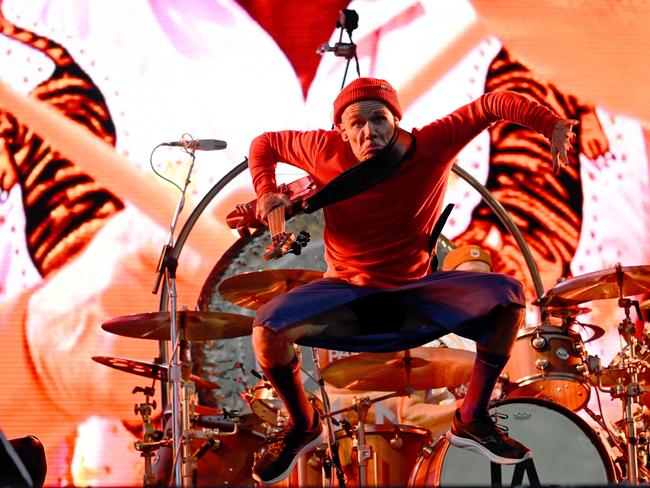 The Red Hot Chili Peppers' Australian-born bassist, Michael Peter Balzary, aka Flea, performs during the Vieilles Charrues music festival in Carhaix-Plouguer, France. Picture: Damien Meyer / AFP