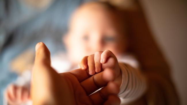 A woman who left her two 19-month-old babies and six-year-old child alone in their Gold Coast home to get Panadol at midnight has been sentenced in court.