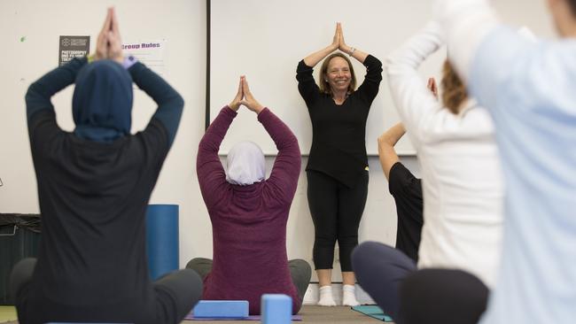 Yoga teacher Lilian Sutila leads a class for anxiety relief at Bankstown Women's Health Centre. Picture: Melvyn Knipe