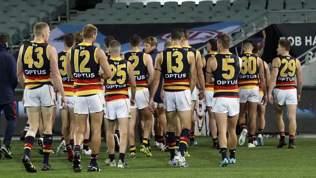 The Crows leaving Adelaide Oval after the heavy Showdown defeat on Saturday night. Picture: Sarah Reed