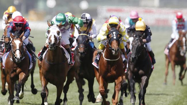 Melbourne Cup Day Races at Flemington Racecourse. Race 7. Melbourne Cup over 3200 metres. Winner Prince of Penzance riddn by Michelle Payne crosses the finish line as Red Cadeaux breaks down in the background . Picture: Michael Klein. Tuesday November 3, 2015. Melbourne, Australia. MelbourneCup15