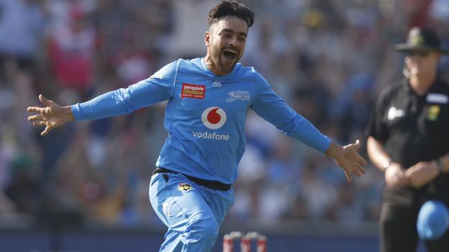 Rashid Khan wheels off in celebration after snaring a hat-trick for the Strikers.