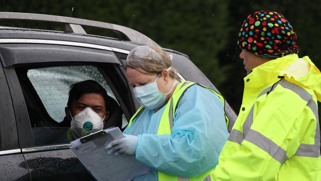 NSW Health have established a Covid-19 pop-up testing clinic at the carpark of the Crossroads Hotel at Casula, after nine people have tested positive to the virus. Picture: David Swift