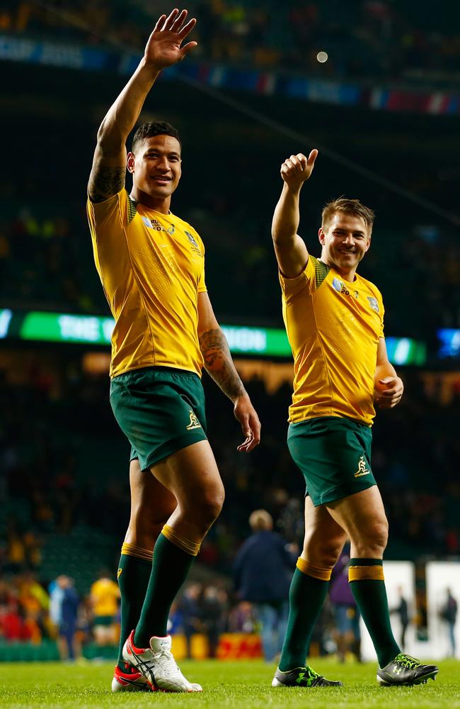 Israel Folau of Australia and Drew Mitchell celebrate victory after the 2015 Rugby World Cup Pool A match between Australia and Wales at Twickenham Stadium. Picture: Getty