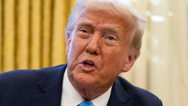 US President Donald Trump speaks to the press after signing an executive order withdrawing his country from a number of United Nations bodies in the Oval Office of the White House on February 4, 2025 in Washington, DC. Trump on Tuesday signed an executive order withdrawing his country from a number of United Nations bodies, including its Human Rights Council (UNHRC), and setting up a broader review of US funding for the multilateral organization. The executive order said it withdrew Washington from UNHRC and the main UN relief agency for Palestinians (UNRWA), and would review involvement in the United Nations Educational, Scientific and Cultural Organization (UNESCO). (Photo by ANDREW CABALLERO-REYNOLDS / AFP)