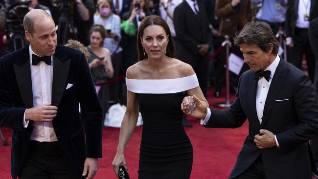 Tom Cruise broke with royal protocol to offer Kate a helping hand. Picture: Getty