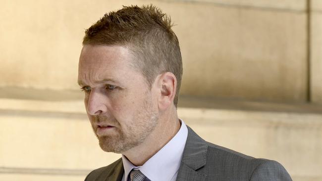 Warren Jon Young pictured entering court before being sentenced for possessing and transmitting child exploitation material. Picture: Naomi Jellicoe