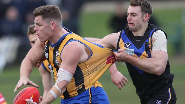 Adam Bentick tries to burst through a tackle in the Premier B decider. Picture: David Crosling