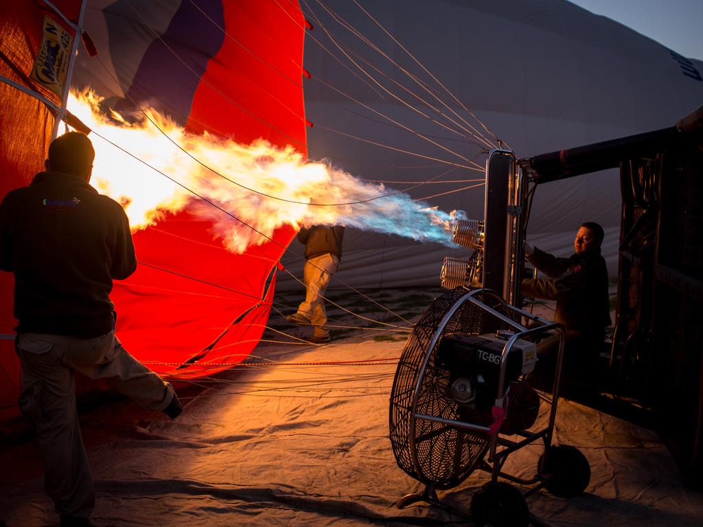 A man inflates a hot air balloon ahead of a tourist flight on April 17, 2016 in Nevsehir, Cappadocia, Turkey. Picture: Getty