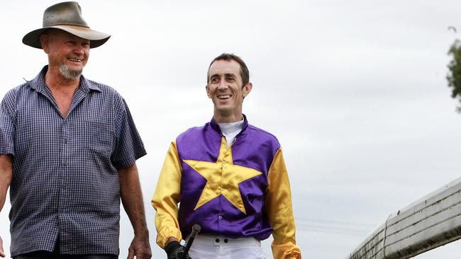 Far North QLD is experiencing a major shortage of jockeys in, with some trainers unable to race their horses on race days because there is no one to ride them. Trainer John Rowan and Jockey Kirk Stone inspect the track at Cannon Park.