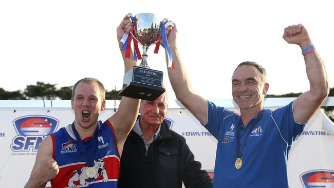 Kieran Knox (L) and Jason Heffernan raise the 2018 SFNL Division 1 silverware. Picture: Hamish Blair