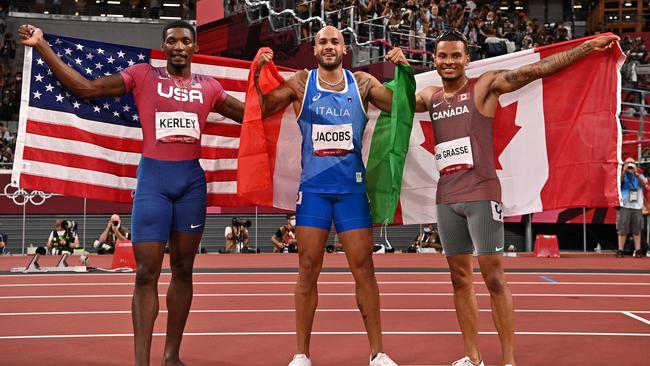 The podium: Silver medallist Fred Kerley, of USA, winner Lamont Marcell Jacobs and Canada’s Andre De Grasse, bronze medal. Picture: AFP