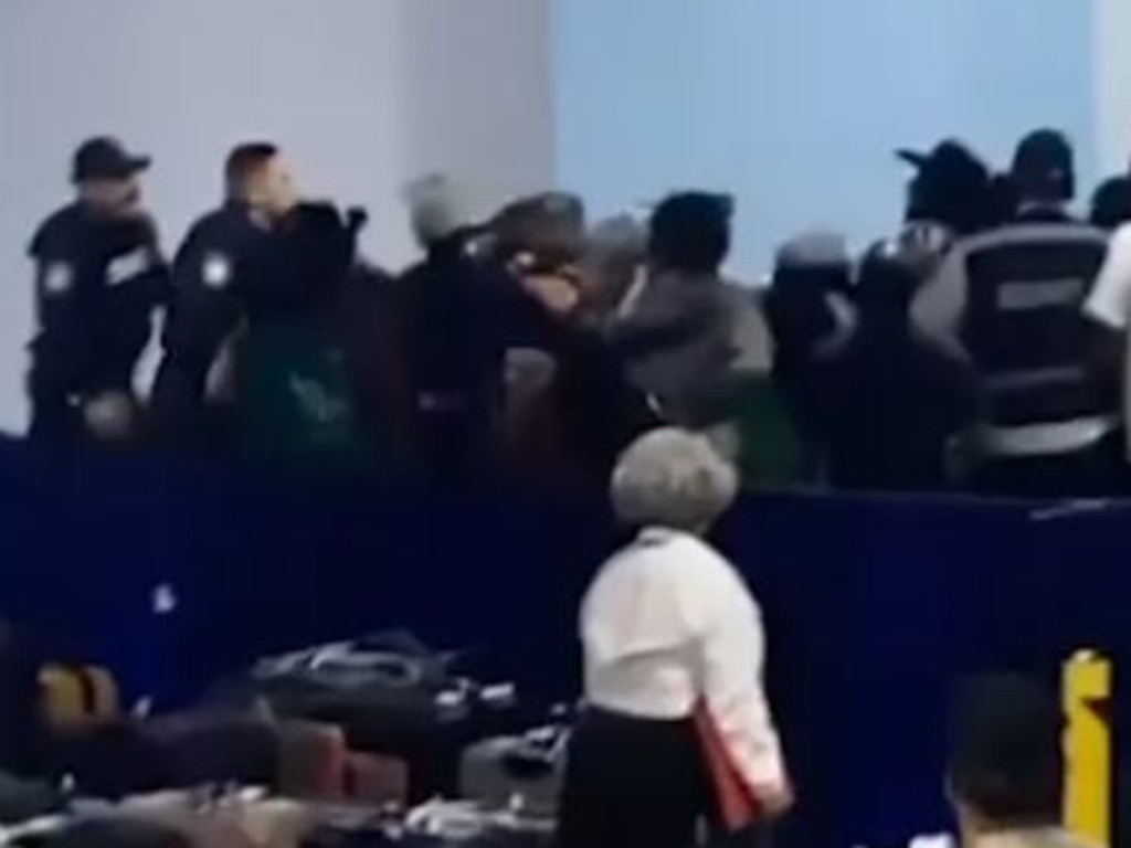 The brawl saw luggage sprawled everywhere and children standing by in shock.