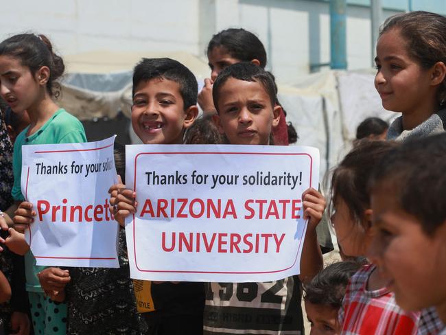 Palestinian children lift placards thanking pro-Palestinian student solidarity initiatives in US and Canadian universities. Picture: AFP