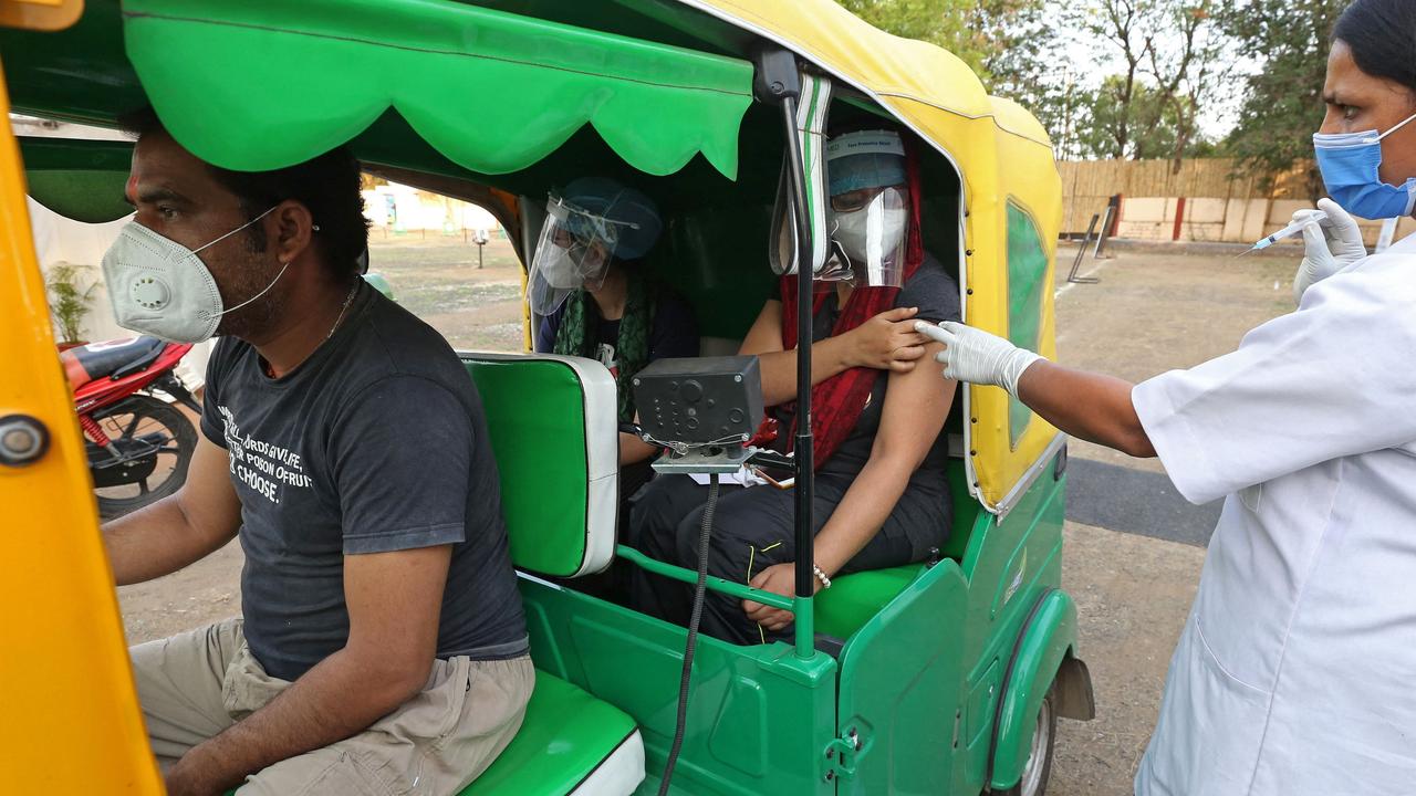 Girl in an auto rickshaw was immunised at a special drive-in vaccination camp in Bhopal, India last weekend. Picture: Gagan Nayar/AFP