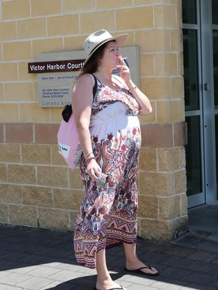 Tziporah Malkah smokes a cigarette while talking to reporters. Picture: Dylan Coker