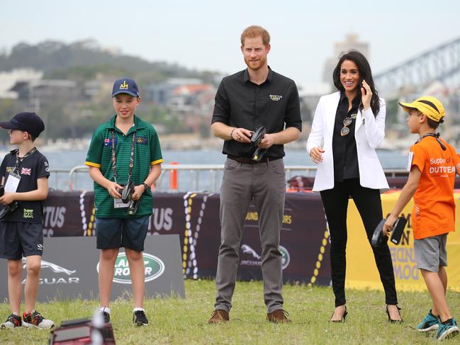 The royal couple went for a more casual look at Cockatoo Island as they played remote control trucks with some children. Picture: Tim Hunter