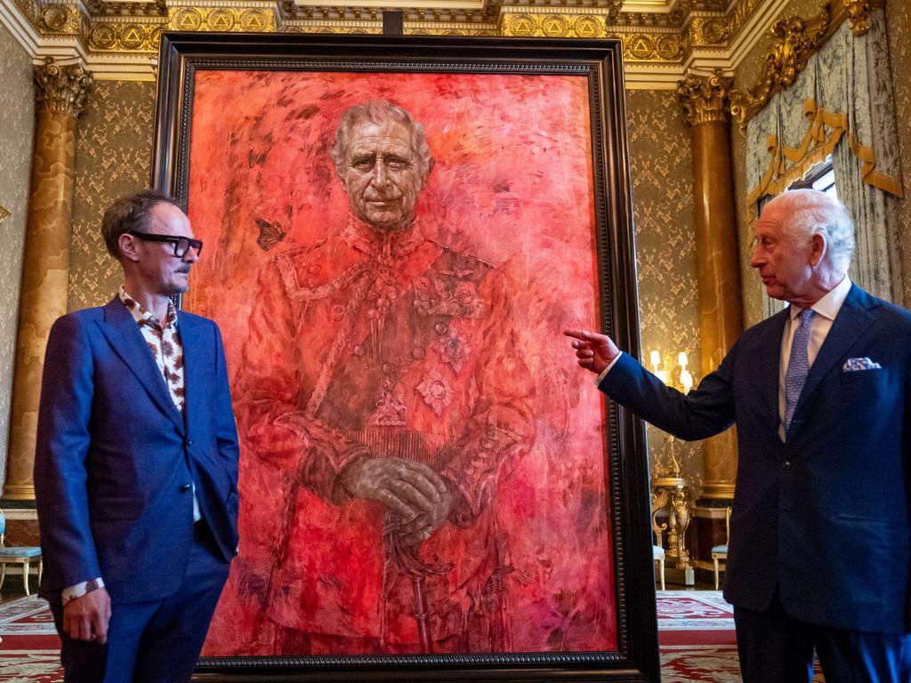 Artist Jonathan Yeo and King Charles III stand in front of the portrait of the King Charles III as it is unveiled in the blue drawing room at Buckingham Palace. Picture: Aaron Chown-WPA Pool/Getty Images