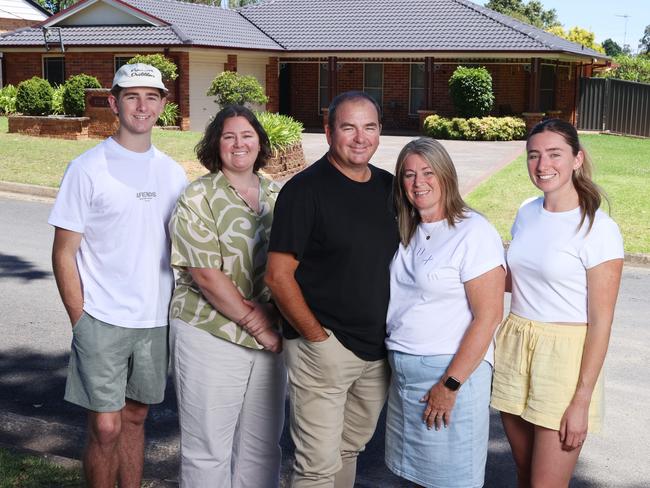 20/12/24: Gary and Kellie Osgood, with their children, Kane, Kara and Abbey. Gary and Kellie purchased their block of land in Appin back in 1995 for $73,000 and built their family home in which they raised their three children.Now looking to downsize, they have just sold for $1.24m. John Feder/The Australian.