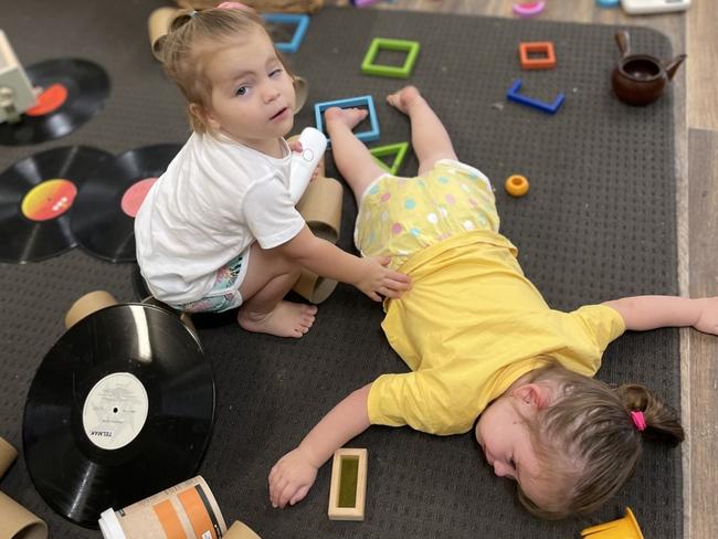 A picture sent to Jade Olsen from the childcare centre on September 14 showed Maddy Olsen comforting her sister Rhylee. Picture: Supplied