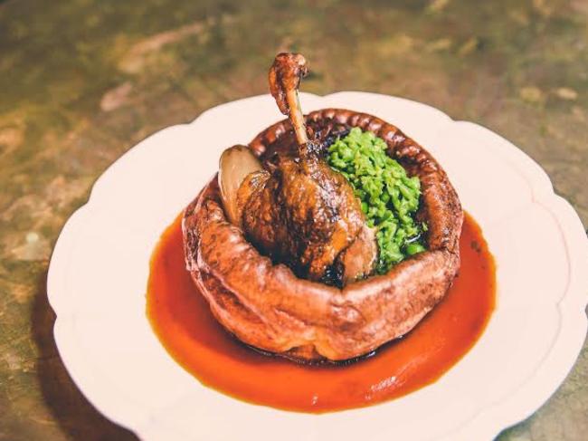 The Morrison, Giant Yorkshire pudding with pulled duck, mushy peas &amp; red wine jus.