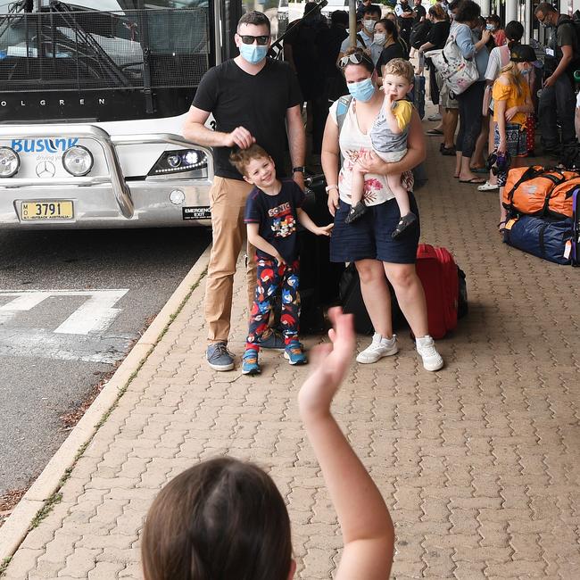 Those who managed to get a flight back to Sydney arrive at Darwin International Airport , Robert and Bridget Griffin with kids Eliot and Oliver say goodbye to there family. Picture Katrina Bridgeford.