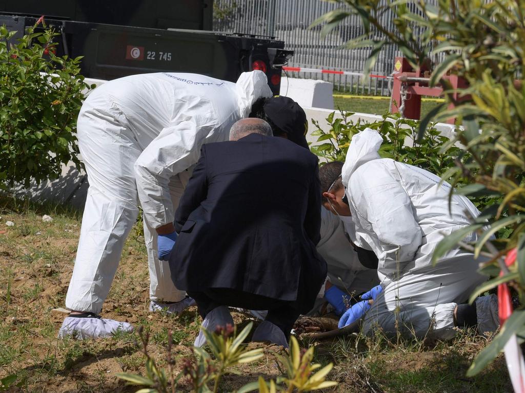 Forensic experts investigate at the scene of an explosion near the US embassy in the Tunisian capital Tunis. Picture: AFP