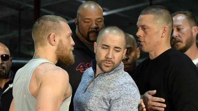 Conor McGregor and Nate Diaz face off at a news conference in February.