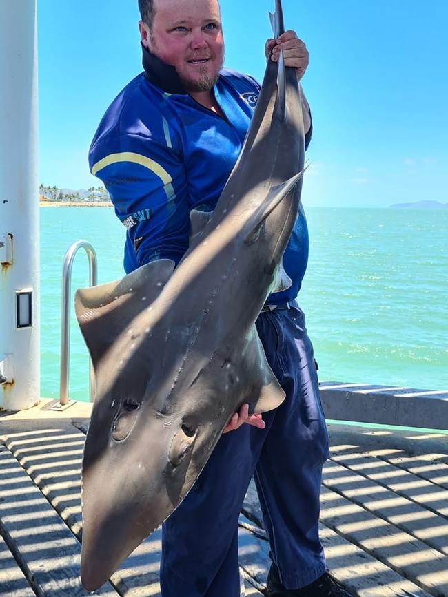 Bradley Mikic with a large shovelnose ray he caught from The Strand Jetty. Photo: Facebook.