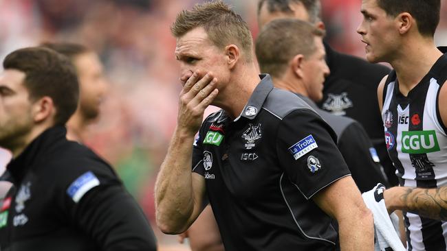 Collingwood coach Nathan Buckley walks off the ground during the Anzac Day loss to Essendon. (AAP Image/Julian Smith)