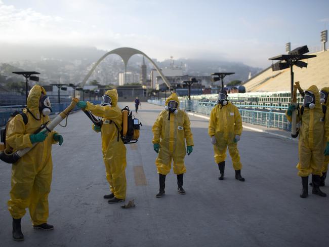 Health workers in Rio get ready to spray insecticide for the mosquitoes that transmit the Zika virus.
