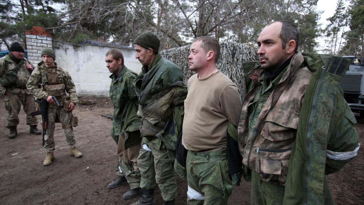 Ukrainian forces detain servicemen of the self-proclaimed Lugansk People's Republic who were captured on February 24, 2022.(Photo by Anatolii Stepanov / AFP)