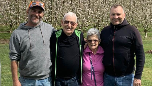 Ernie Hall with his wife Christine and sons Chris (left) and Jono (right)