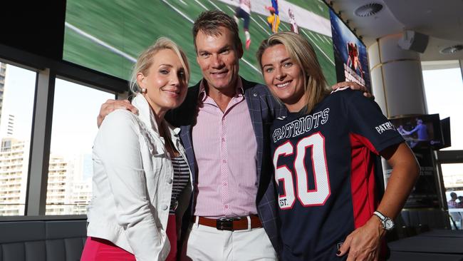 Super Bowl celebrations at The Star Gold Coast are attended by radio personality Emily-Jade O'Keefe with MC and Ex- AFl legend Richard Champion, and Rachel Thaiday, wife of Broncos star Sam Thaiday. Picture: Glenn Hampson