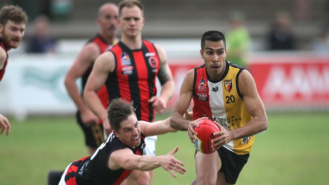 Goodwood Saints’ Ben Holzbauer clears the ball during the 2020 Adelaide Footy League division one grand final against Rostrevor Old Collegians. Picture: Dean Martin