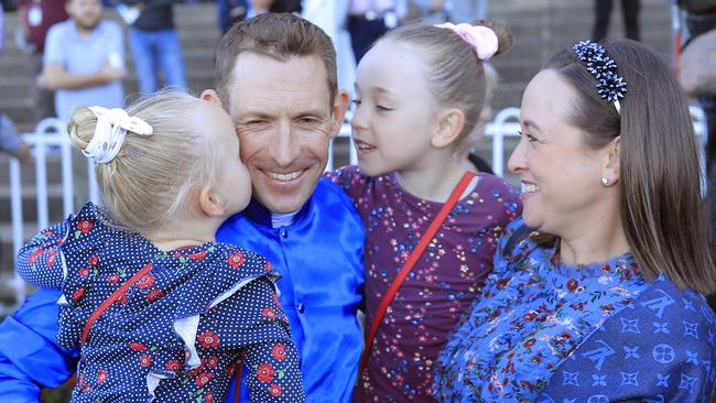 Hugh Bowman celebrates another big-race win with his daughters Paige and Bambi, and wife Christine at Rosehill Gardens. Picture: Getty Images