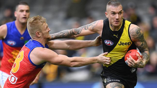 Dustin Martin of the Tigers (right) and Nick Robertson of the Lions.