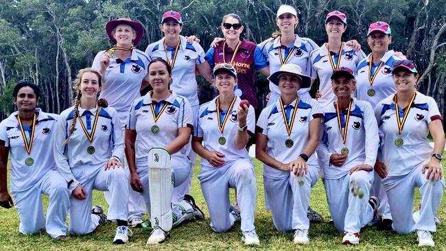 Coolum Women's cricket team celebrate winning the 2022/23 Division 1 grand final.