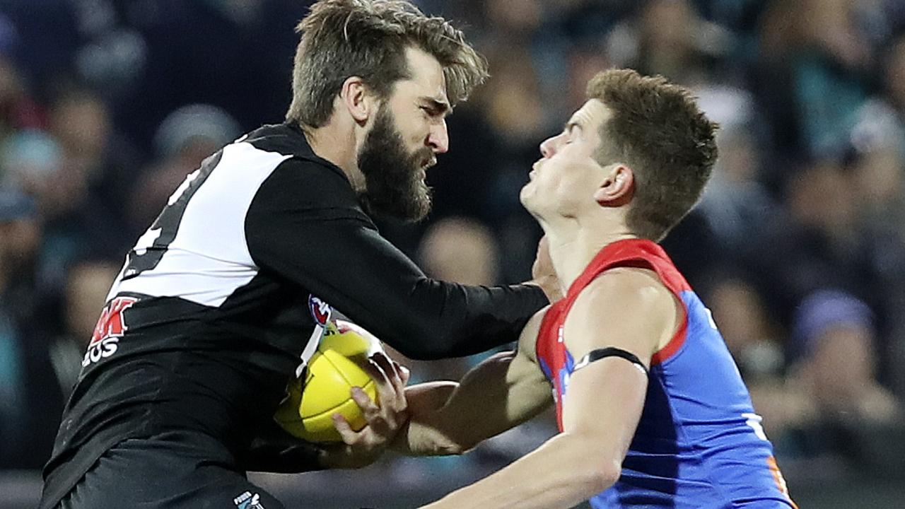 22/06/18 - AFL - Round 14 - Port Adelaide v Melbourne at Adelaide Oval. Justin Westhoff fends off Bayley Fritsch. Picture SARAH REED