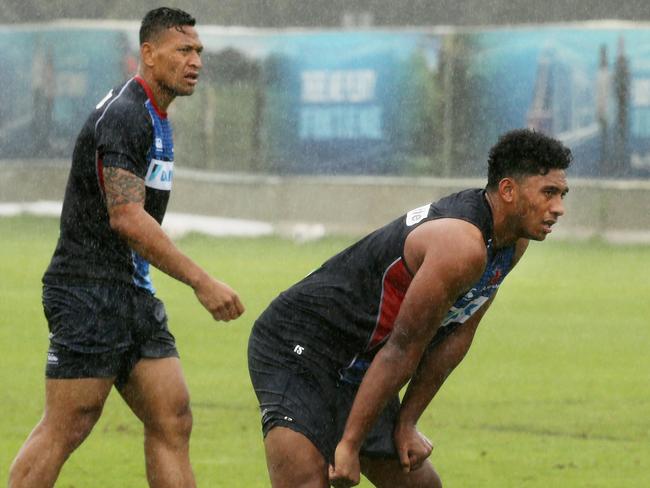 Irae Simone trains inside Israel Folau. Picture: Mark Evans