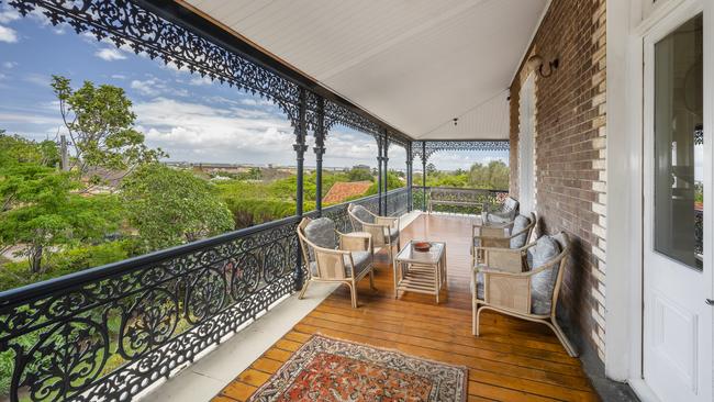 The gated heritage-listed two level homestead has wrap­around verandas on both floors that overlook sprawling gardens.