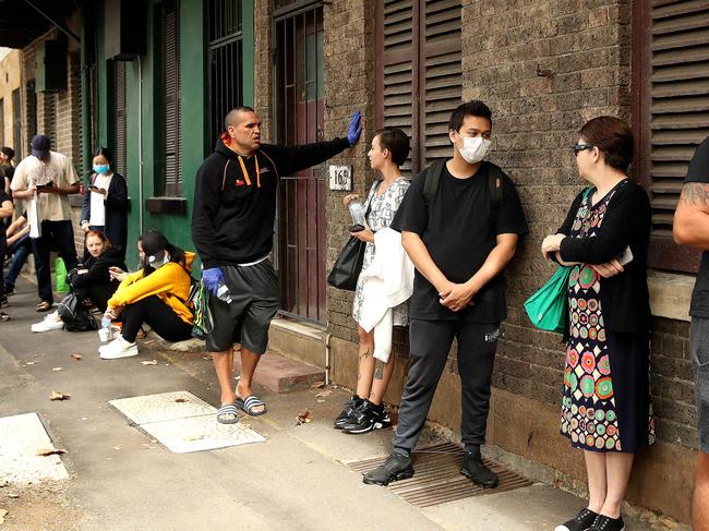 Boxer Anthony Mundine was spotted handing out waters to people in the Darlinghurst Centrelink queue. Picture: Phil Hillyard