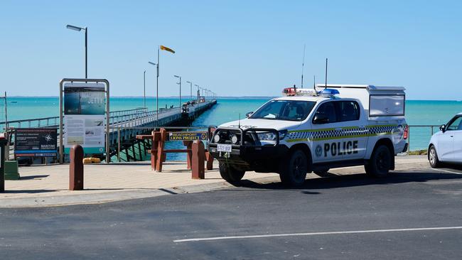 Police at Beachport Jetty after a shark attacked local swimmer Pamela Cook. Picture: Frank Monger